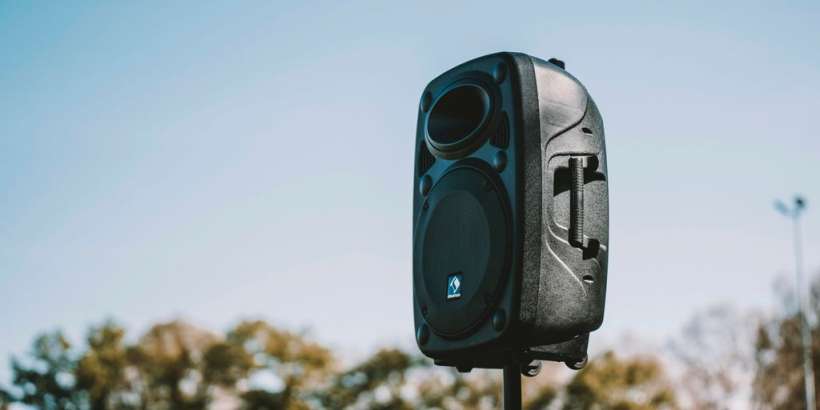 a black and white camera on a pole